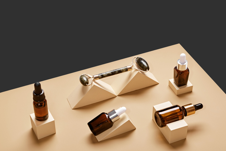 Beauty natural skincare product mock up. Serum or Collagen Dropper Bottles on different geometric podiums. Skincare products presentation